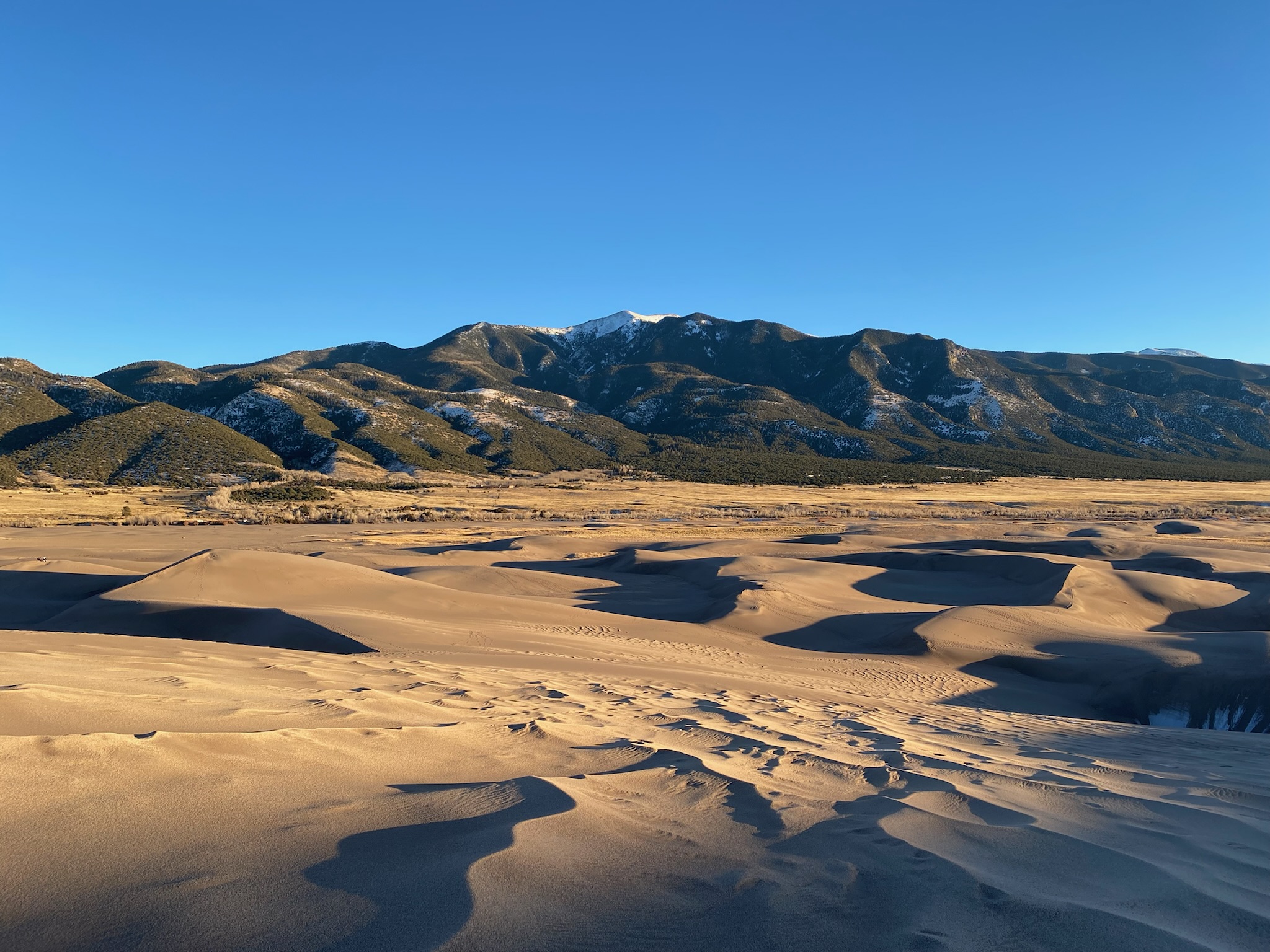 Mountains and sand dunes in the sunset